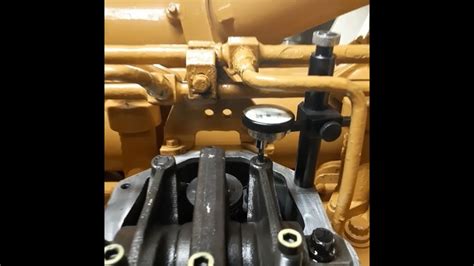 0015 inch). . Cat 3512 valve adjustment procedure